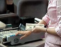 Giữ nguyên lãi suất cơ bản, nới biên độ tỷ giá 