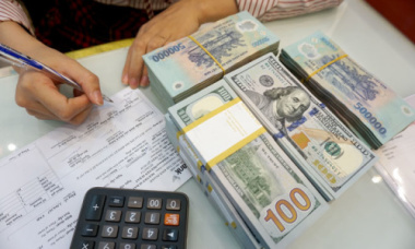 VND không bị mất giá so với USD sau khi Fed tăng lãi suất